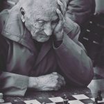 elderly man playing chess